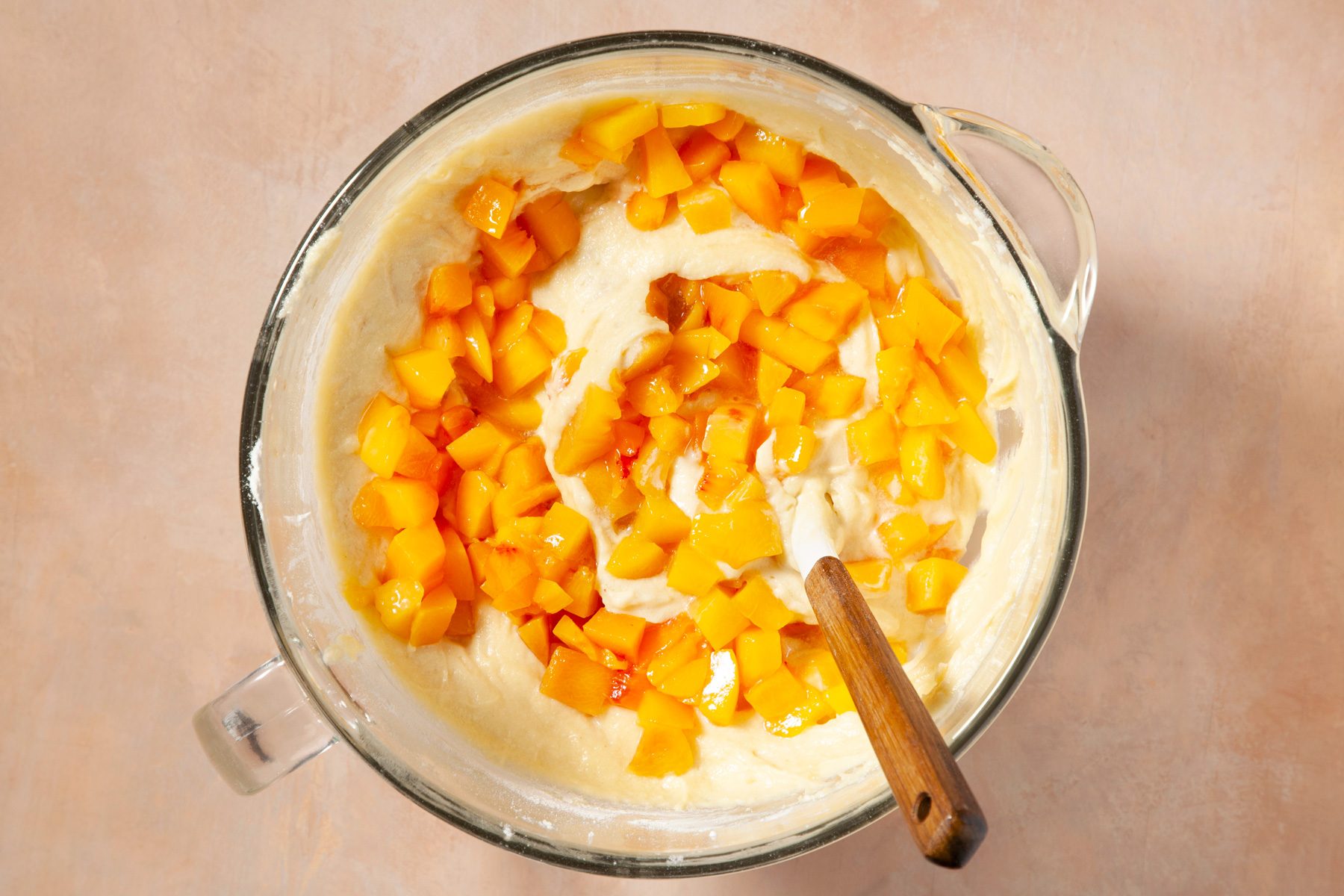 Folding peaches with the mixture top view shot