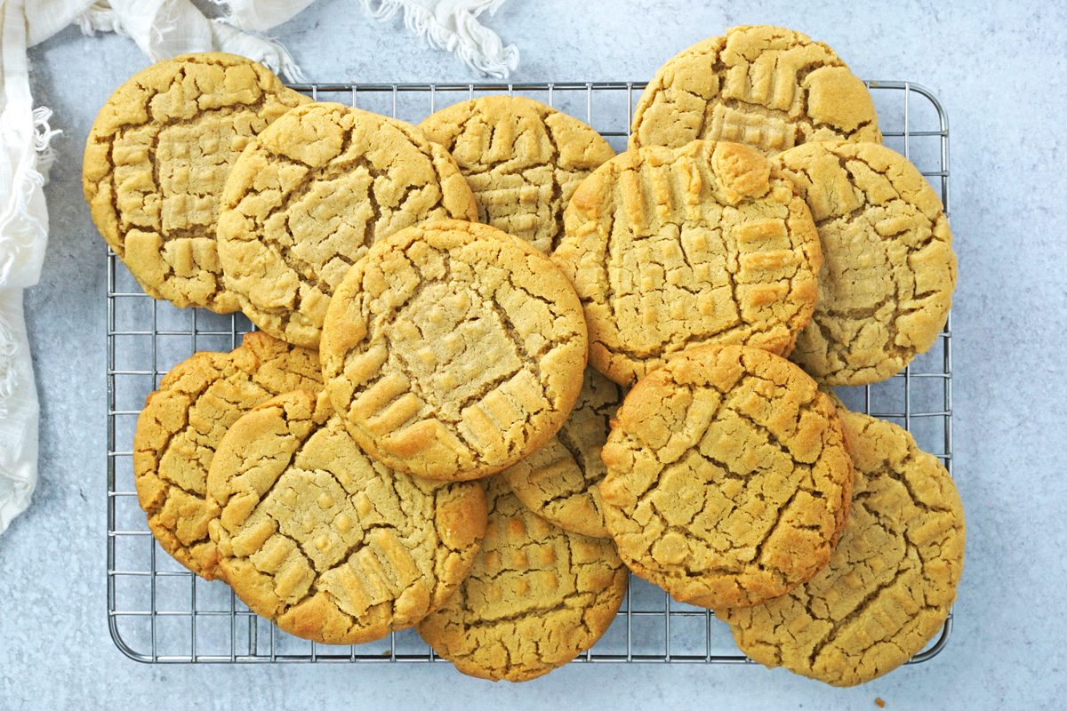 A cooling rack with piles of Taste of Home old fashioned peanut butter cookies RMS 7873