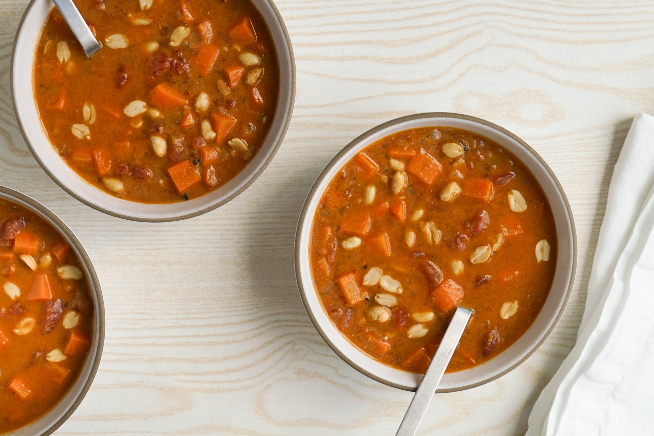 Peanut soup topped with roasted peanuts
