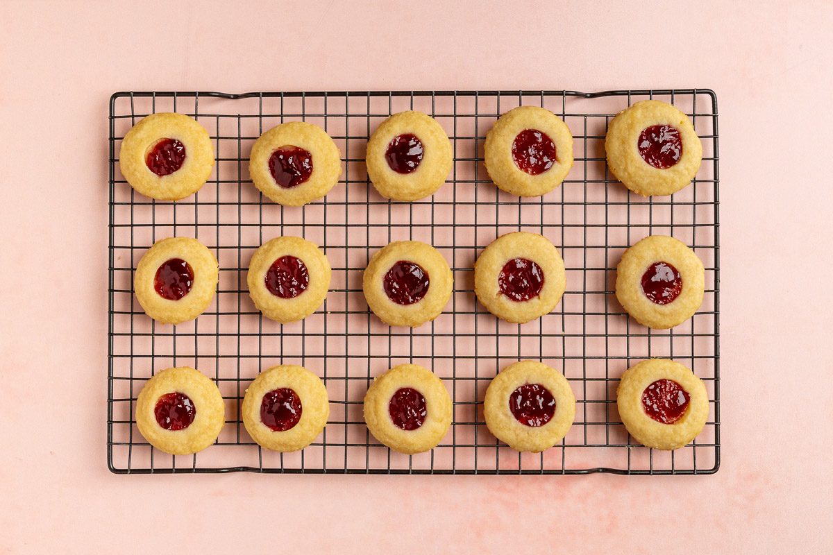 Taste of Home Shortbread Cookies with Jam recipe photo of the baked cookies on a cooling rack.