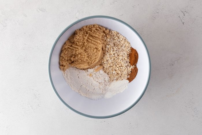 Soft Blueberry Oatmeal Muffins dry ingredients in a mixing bowl.