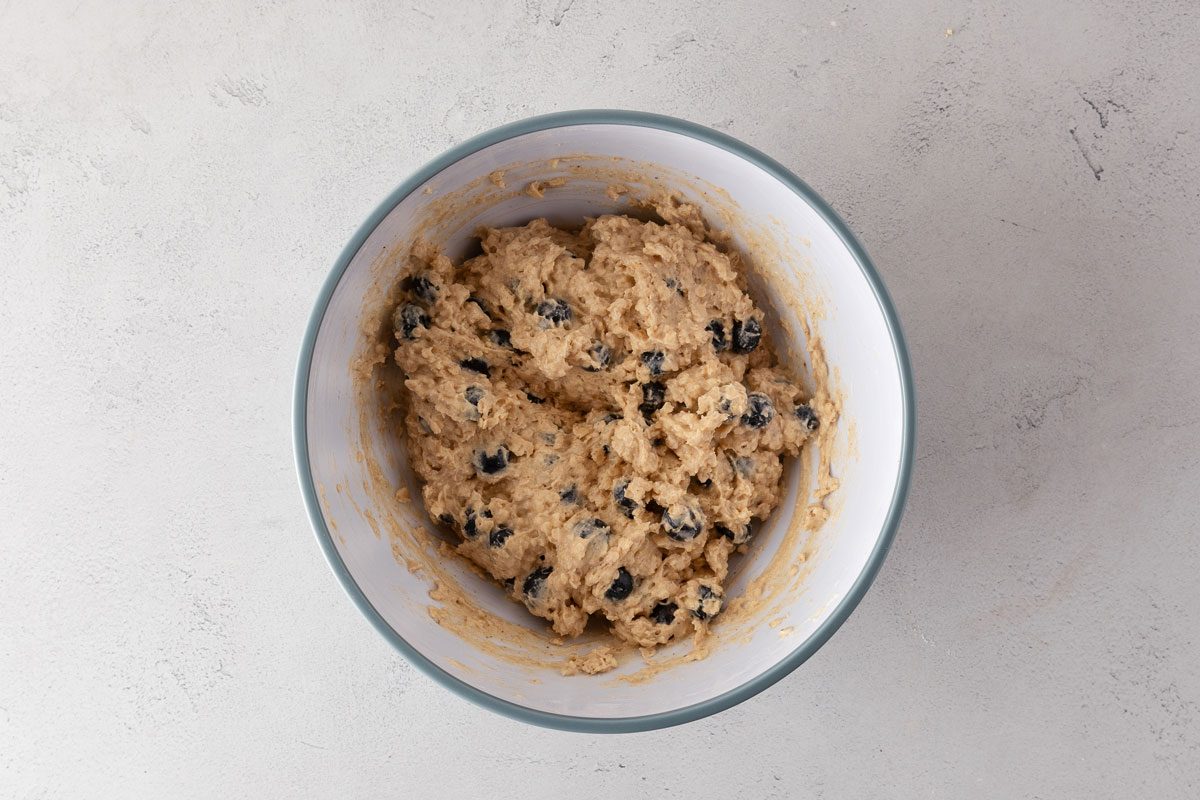 Soft Blueberry Oatmeal Muffins batter in a mixing bowl.