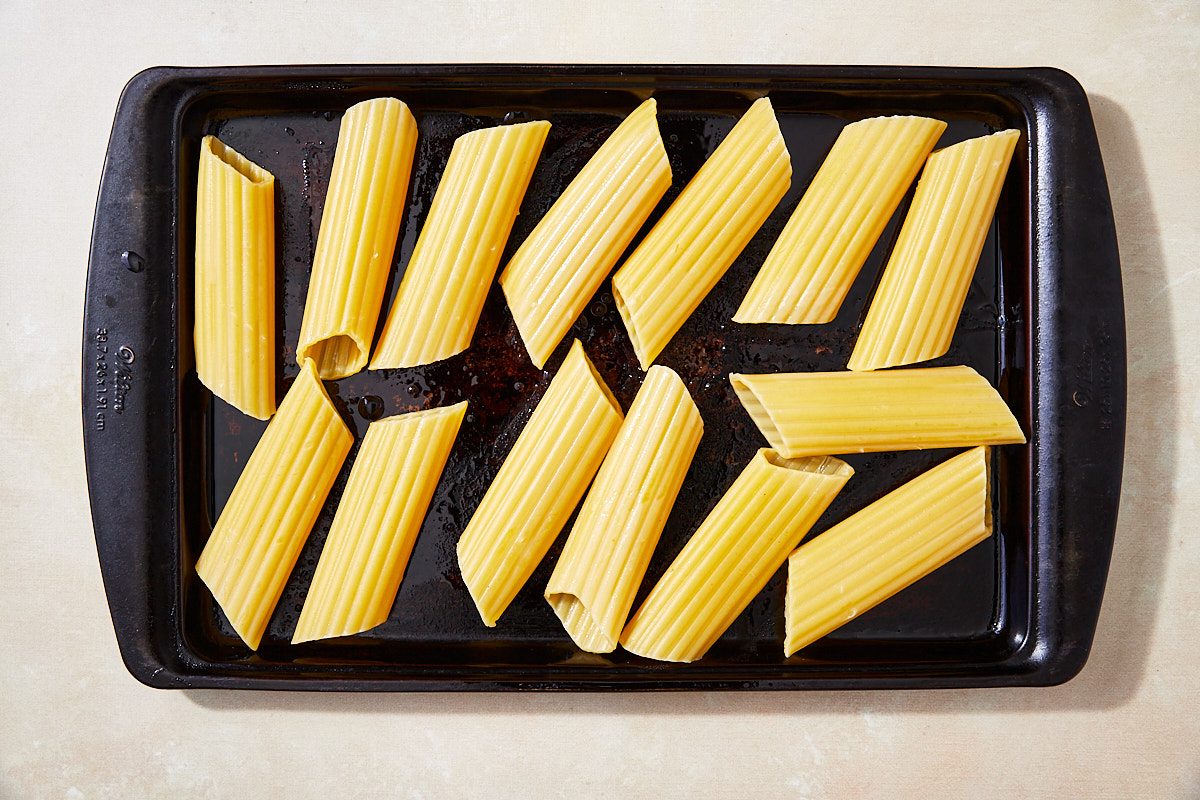 String Cheese Manicotti Step 1- Cooked shells on rimmed baking sheet