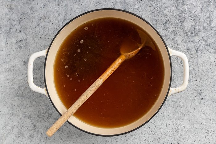 Taste of Home Thai Chicken Noodle Soup photo of the strained broth with brown sugar, fish sauce and lime juice.