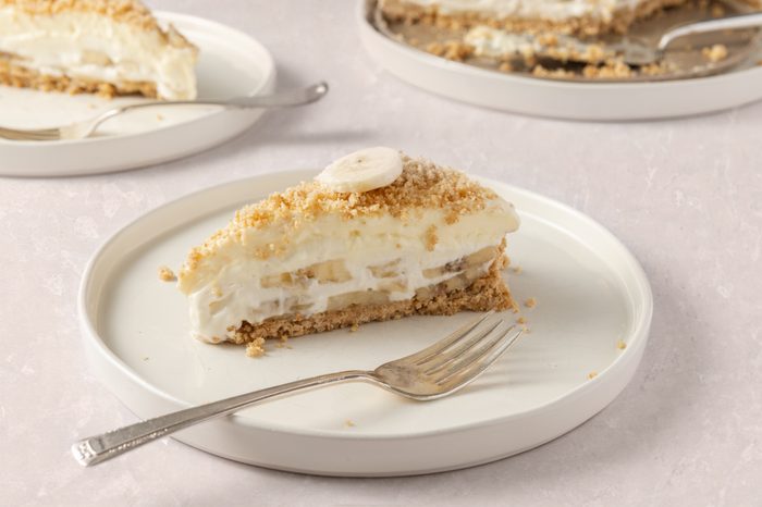 Banana cream cheesecake slices served on plates.