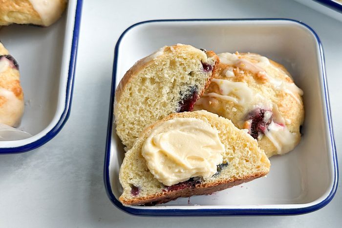 Taste of Home Blueberry Biscuits on enamal dishes on a marble surface