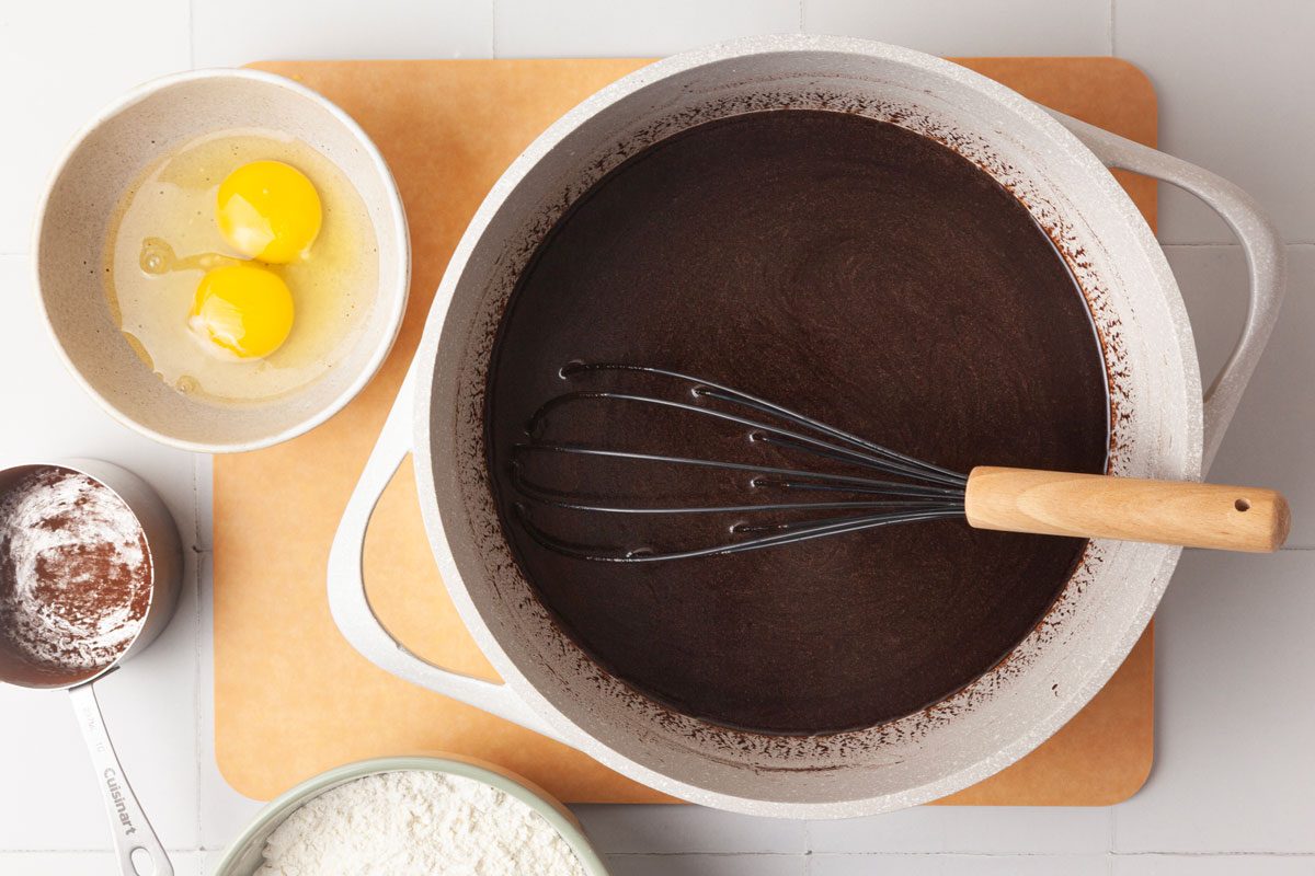 Step 2 of Taste of home Brooklyn Blackout Cake is to whisk the flour, baking powder, baking soda and salt. In a large saucepan, melt the butter over medium heat. Add the cocoa; cook and stir it until blended. Stir in the sugars. Remove it from heat; stir in the buttermilk, coffee and vanilla. Whisk in the eggs, one at a time, until blended. Stir in the flour mixture just until combined.