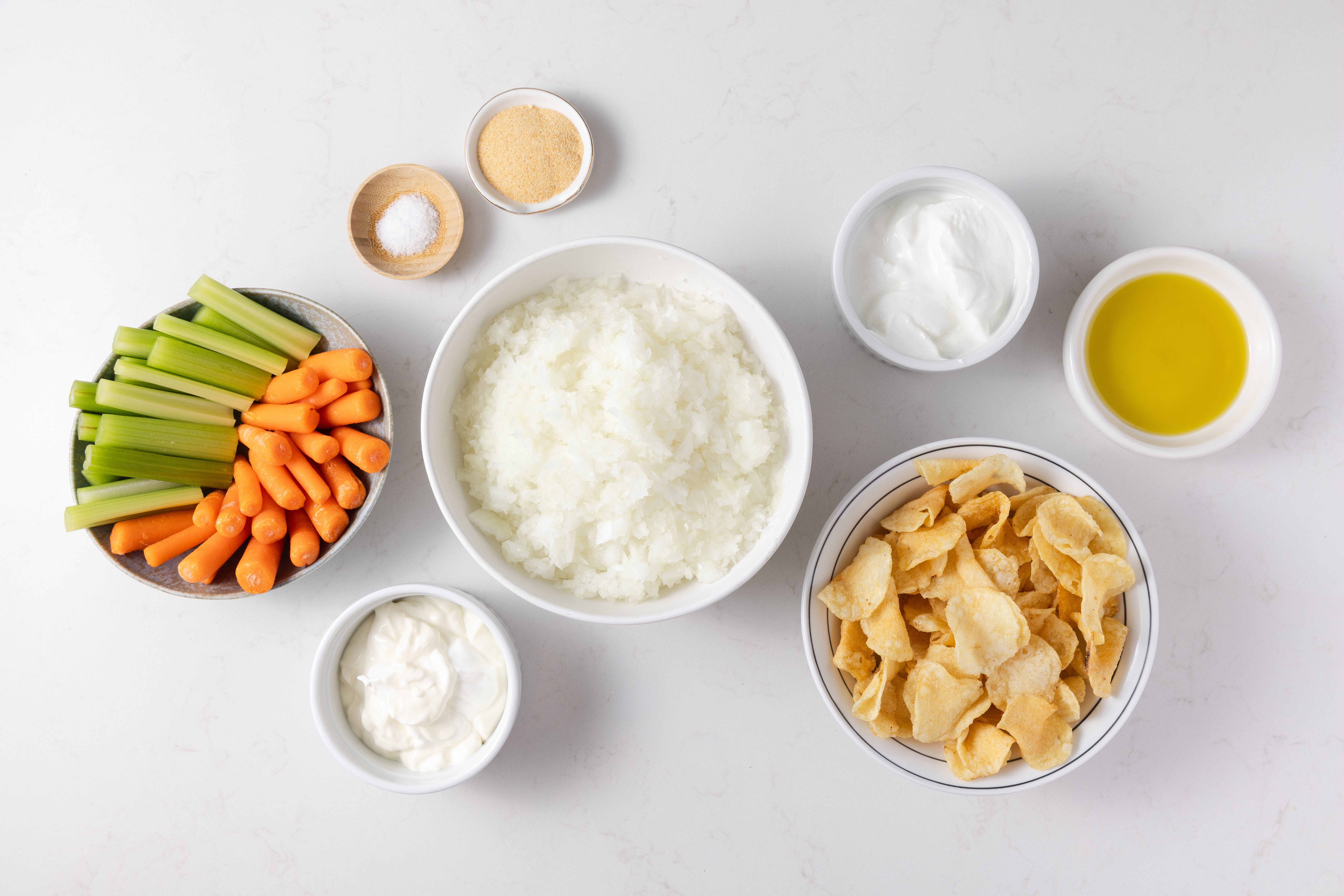 Ingredients for caramelized onion dip on kitchen counter.