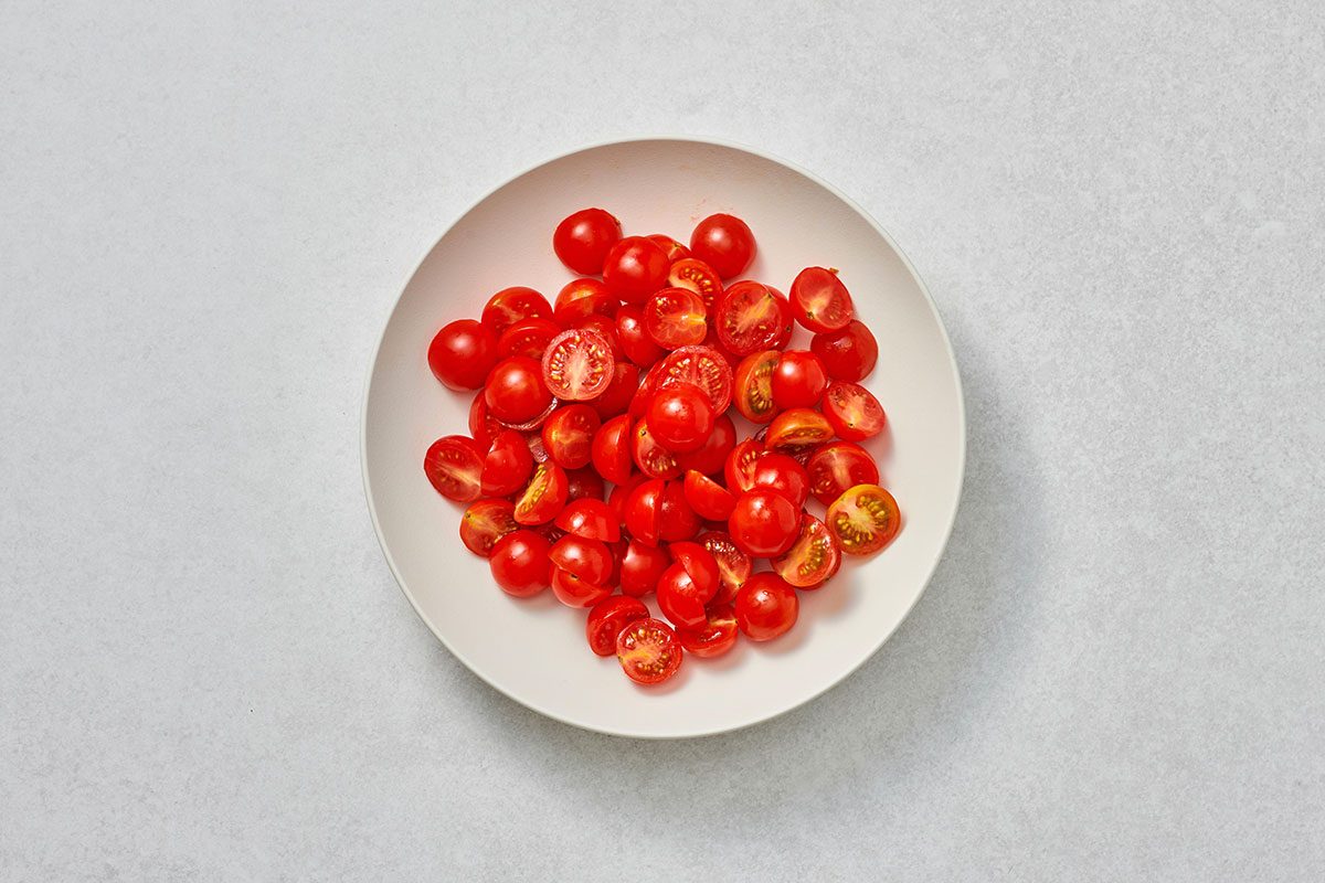 Sliced tomatoes in a shallow serving bowl
