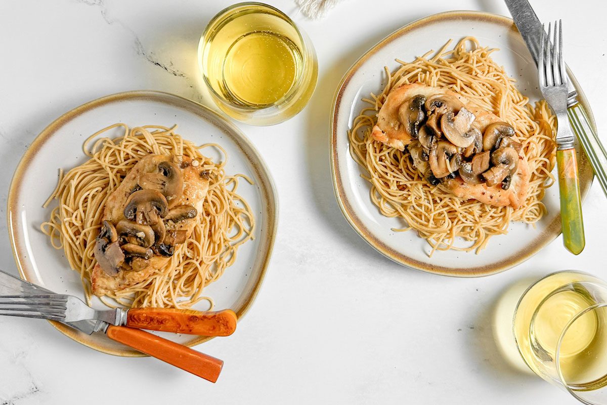 Taste of Home Chicken Marsala over pasta on ceramic plates