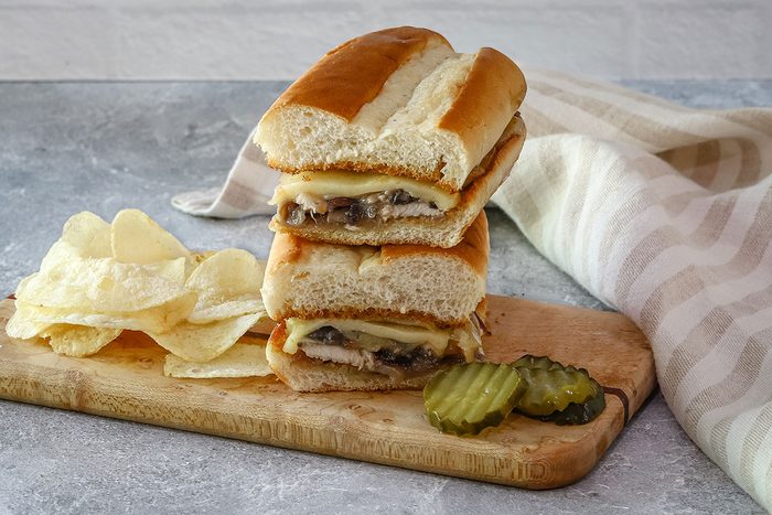 Cheesy chicken subs with mushrooms, Swiss cheese, and red onions.