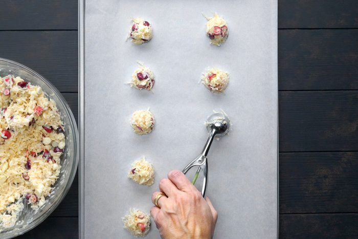 top view shot of cookie batter scooped on parchment paper