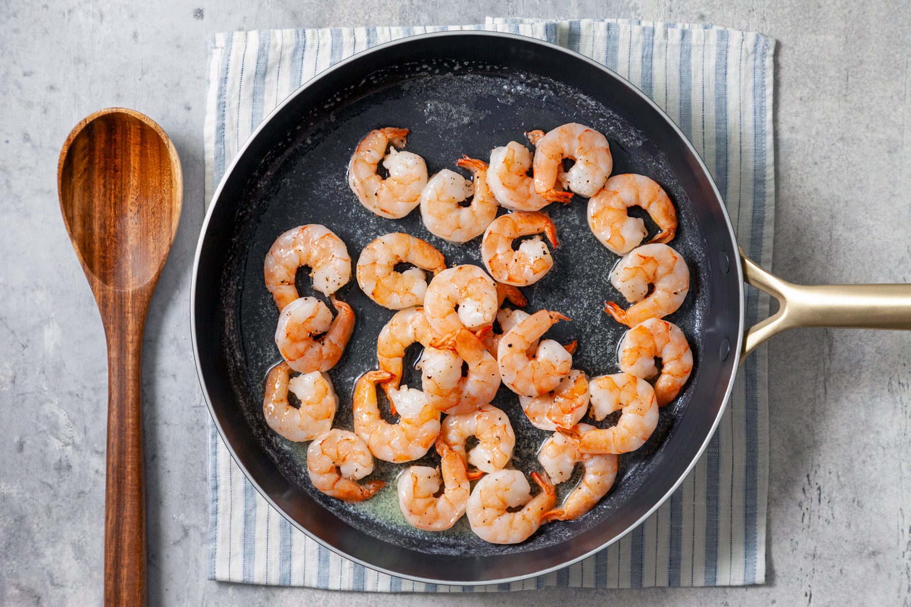 overhead shot of shrimp cooked in a large skillet