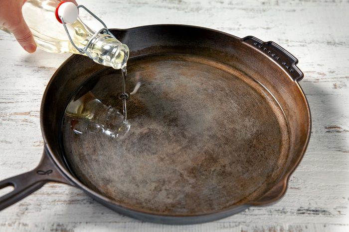 3/4th shot of oil poured into skillet