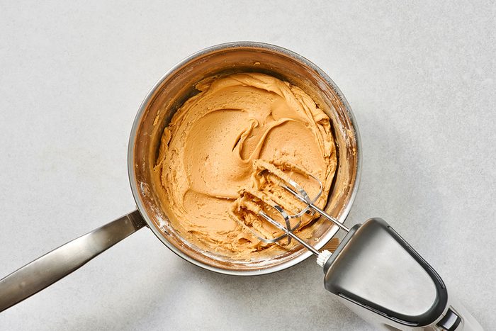 Confectioners sugar added until the frosting reaches a spreadable consistency