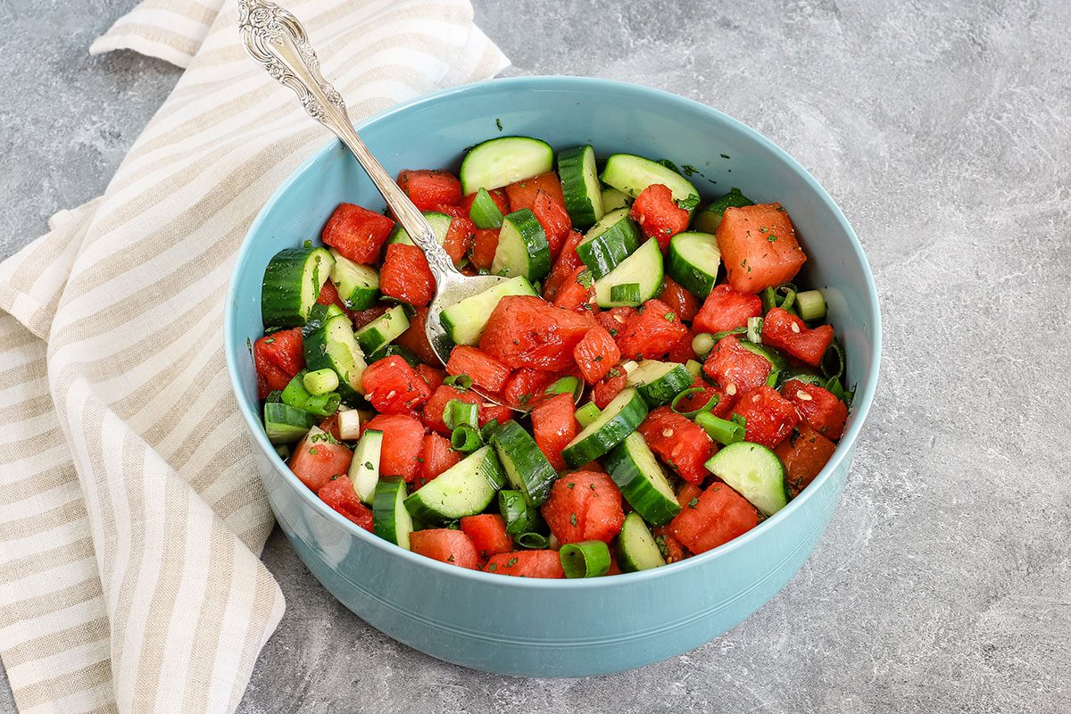 A large serving bowl with cucumber watermelon salad, from a recipe by Taste of Home.