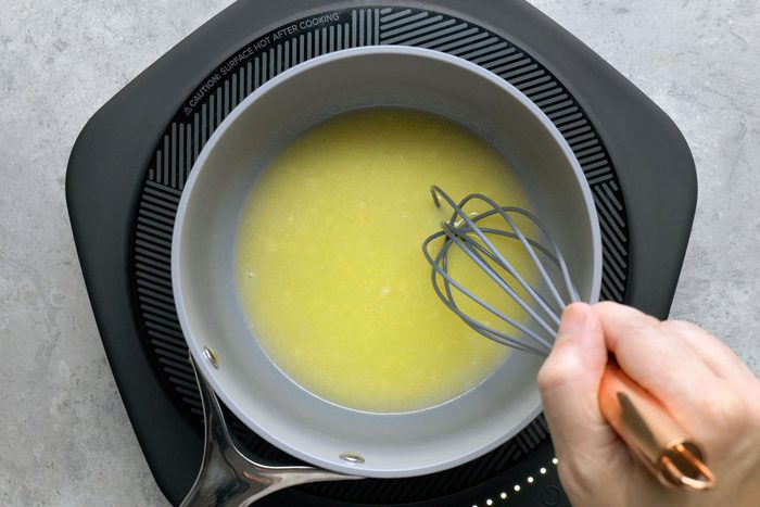 In a large sauce pan melting butter over medium heat using a whisker