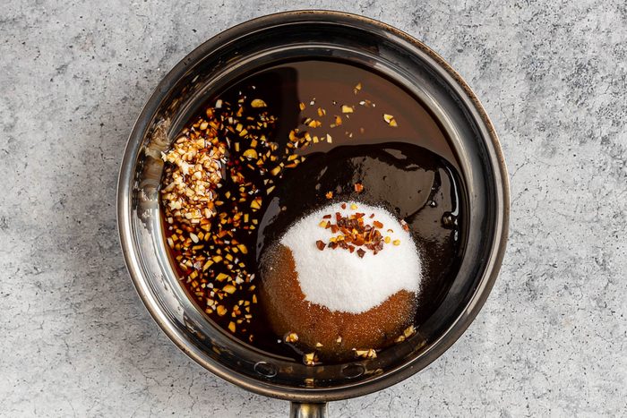 Taste of Home Hoisin Pork Tenderloin photo of combining the hoisin, soy sauce, sugar, garlic and red pepper flakes in a small unheated saucepan.