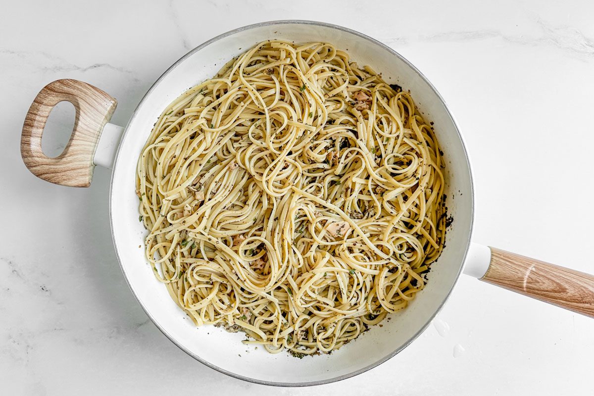 Taste of Home Linguine with Clam Sauce in a white skillet on a marble surface