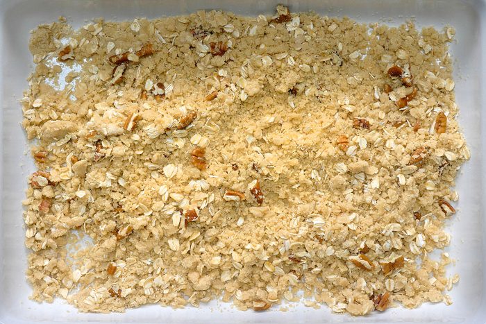 Oatmeal cookie crust ingredients in a pan.