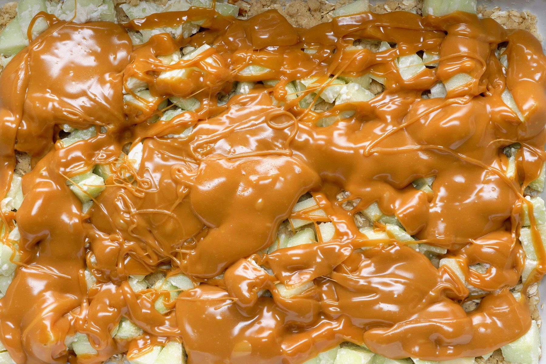 caramel sauce drizzled over apples.