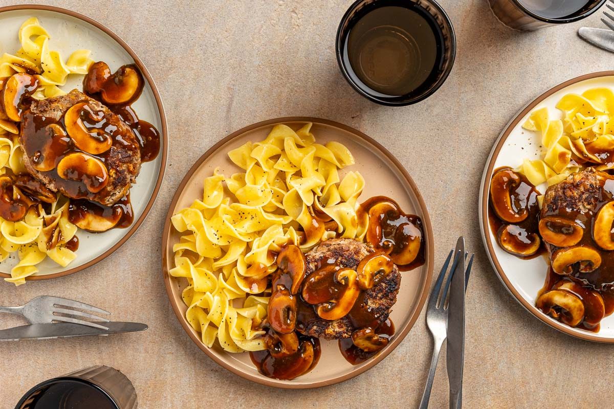 Old Fashioned Salisbury Steak on a plate with noodles