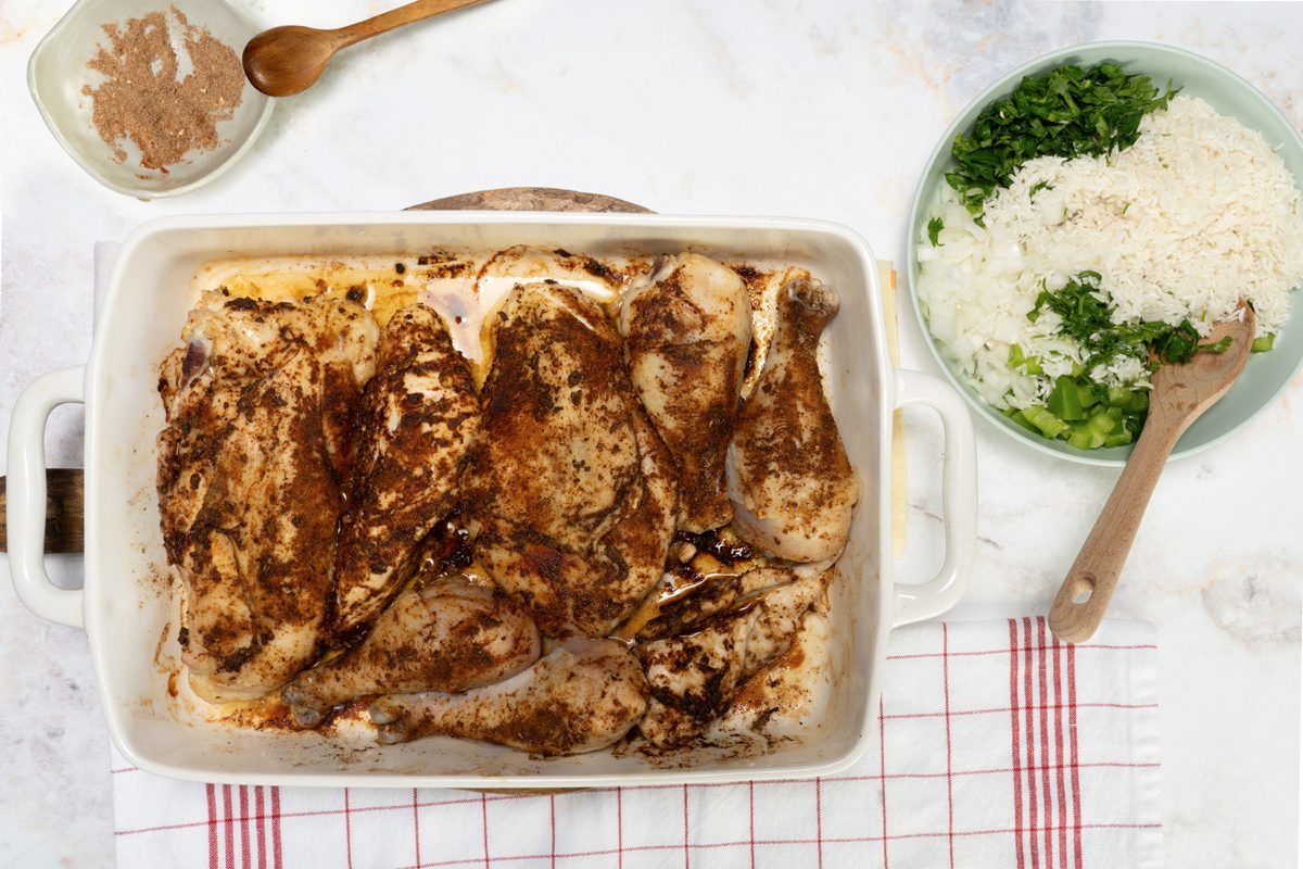 Prepping the chicken with spices