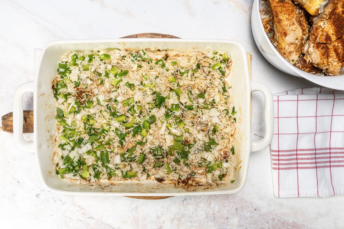 Covering the bottom of the pan with the rice mix