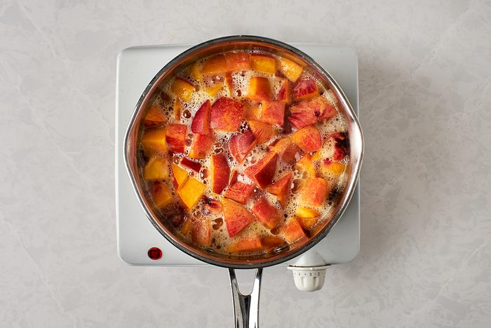 Simmer peach syrup