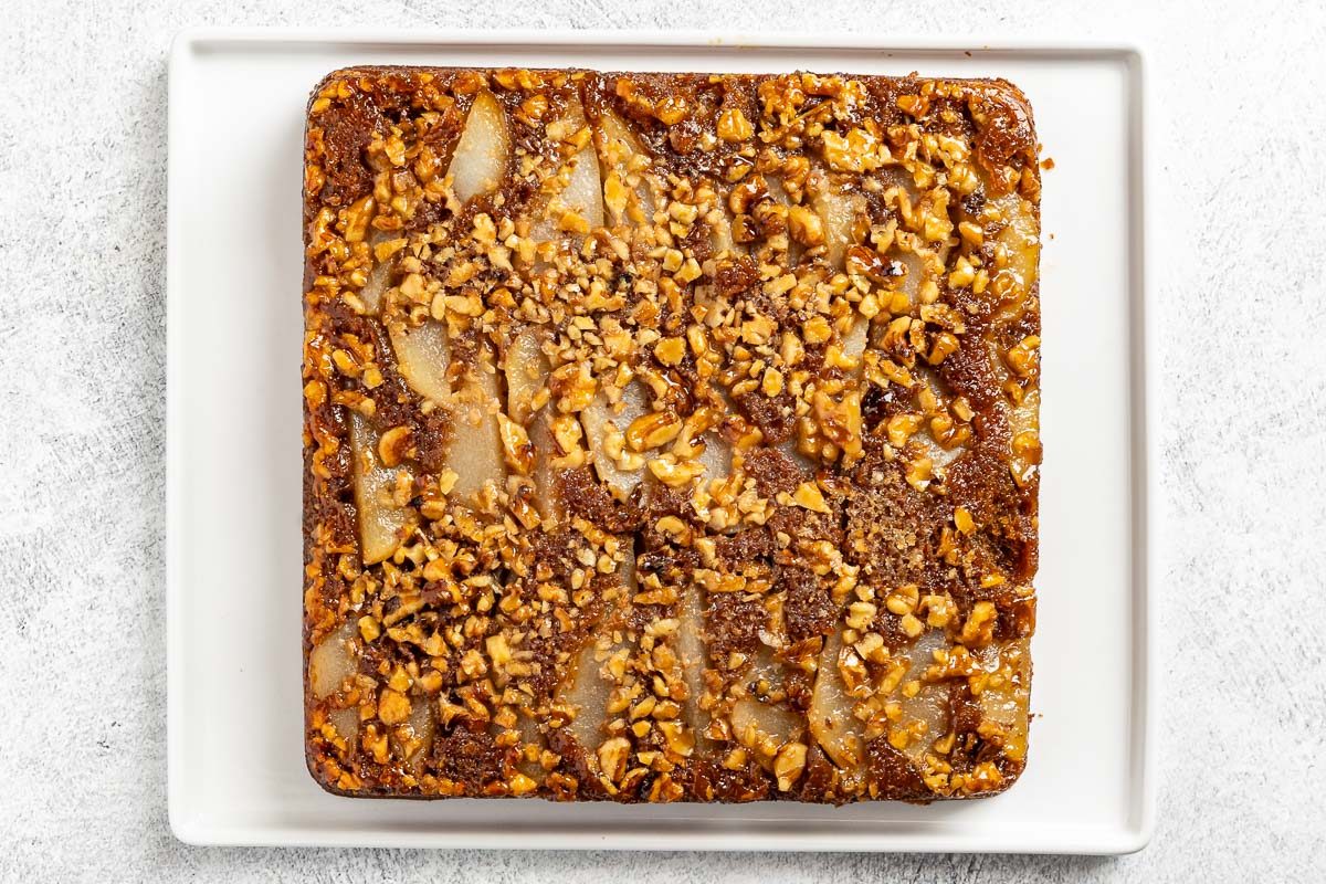 Taste of Home Pear Upside Down Cake recipe photo of the baked cake on a platter.