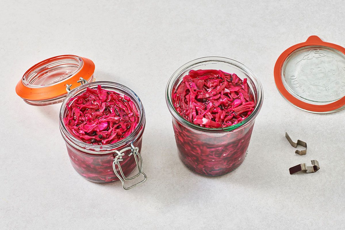Red cabbage with brine transferred to jars