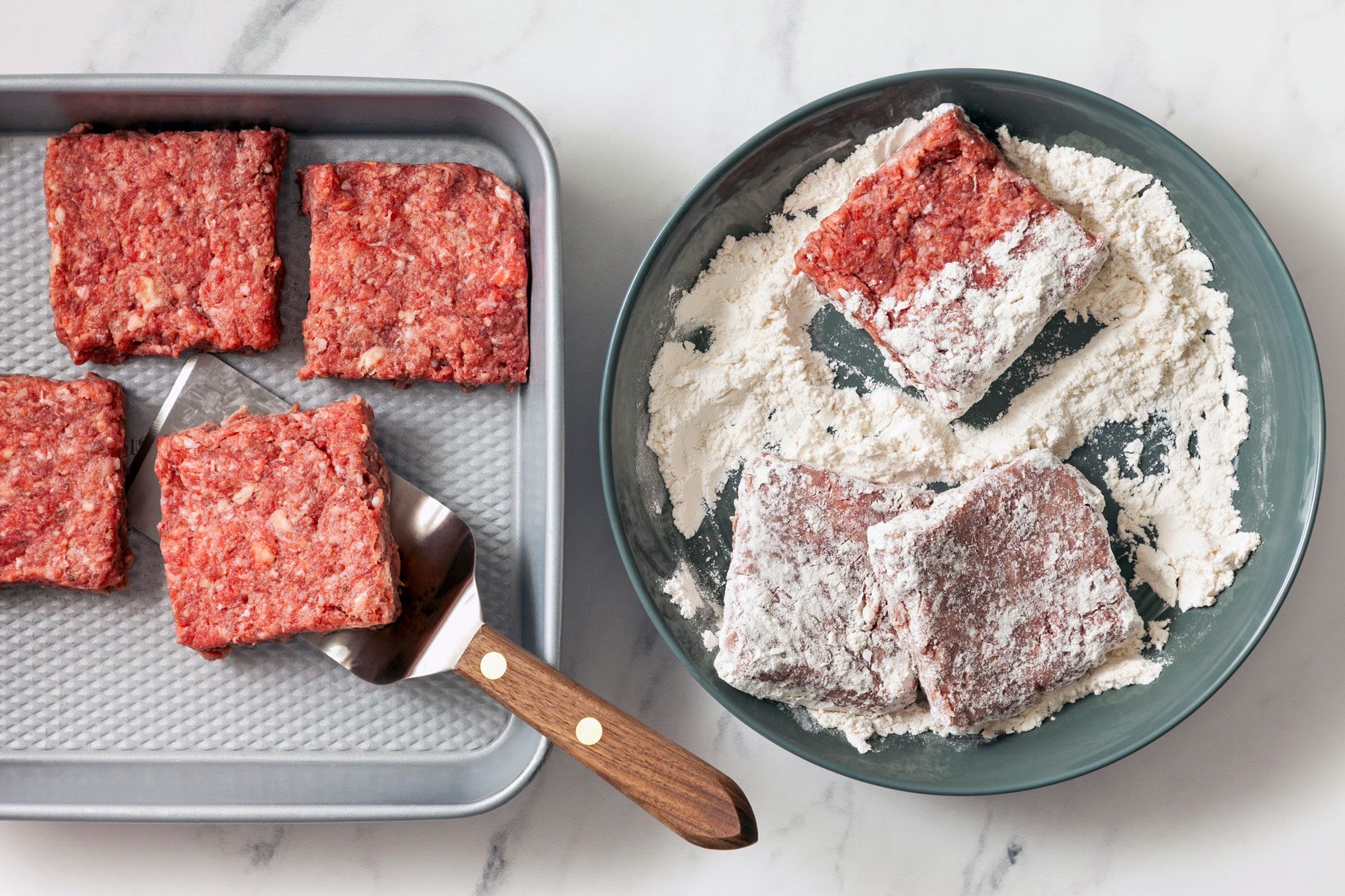 Square steaks dredged in flour.