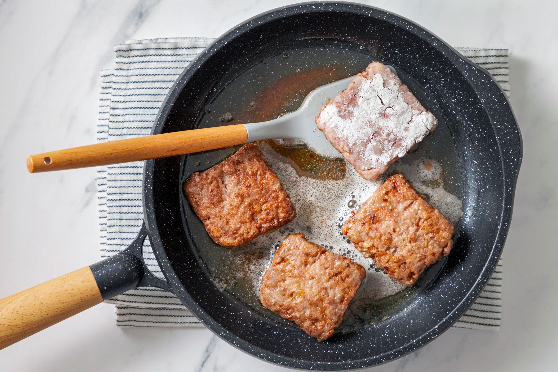 Steaks cooked in a skillet.