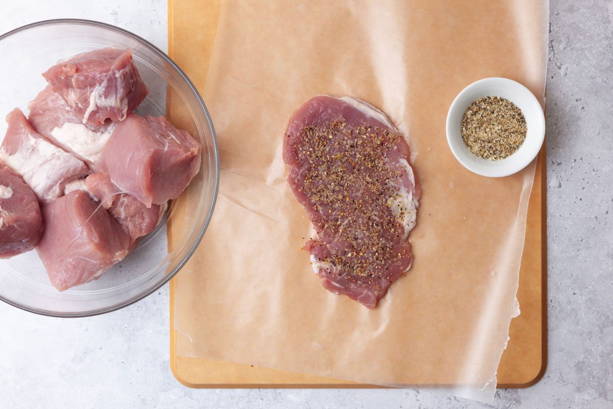 Step 1 of Taste of Home Pork Diane is to cut the pork tenderloin into eight even pieces and place each piece between two sheets of waxed paper. Using a kitchen mallet, flatten each cut to 1/2-inch thickness and then sprinkle each piece with the lemon-pepper seasoning.