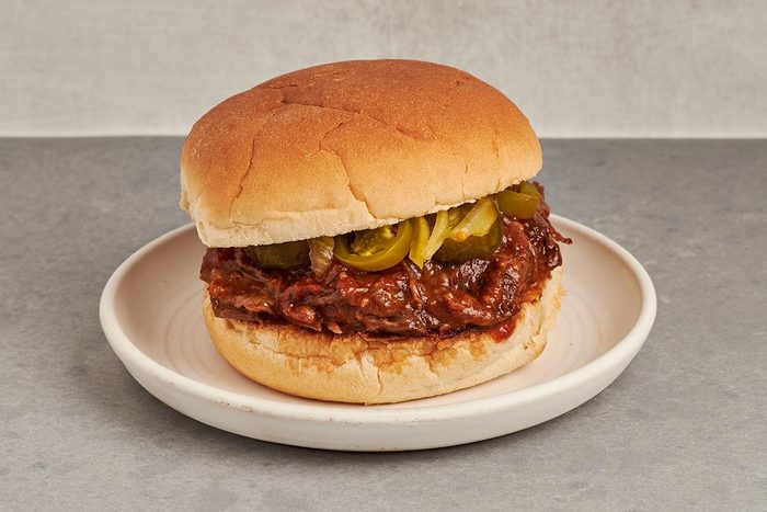 This tender pulled beef sandwich by Taste of Home features slow-cooked chuck roast in a flavorful barbecue sauce.