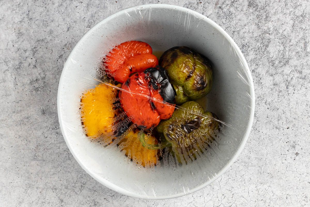 Taste of Home Roasted Pepper Salad photo of the roasted peppers in a covered bowl.