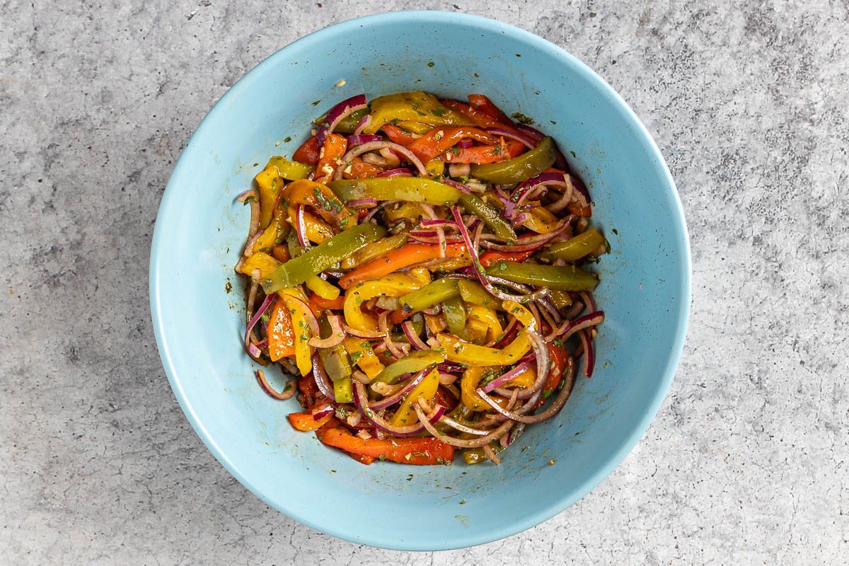 Taste of Home Roasted Pepper Salad photo of the vinaigrette added to salad.