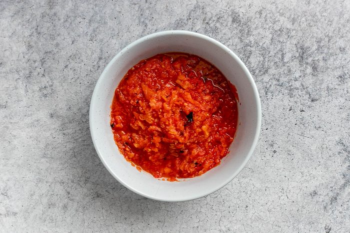 Taste of Home Roasted Salsa Recipe photo of all the tomatoes processed and in a large bowl.