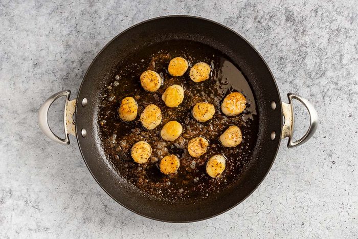 Taste of Home Scallop Salad photo of the cooked scallops in a skillet.