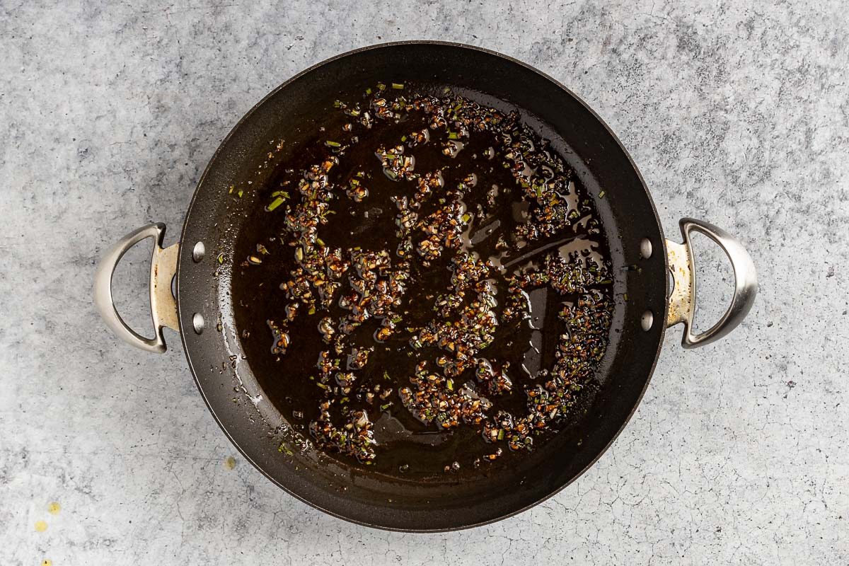 Taste of Home Scallop Salad photo of the warm dressing in the skillet.