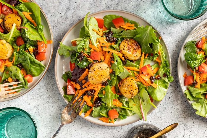Taste of Home Scallop Salad photo of the finished recipe served on plates.