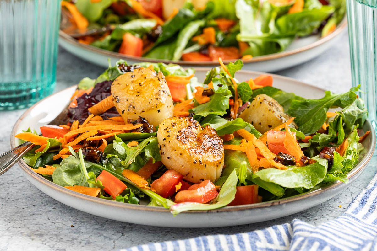 Taste of Home Scallop Salad photo of the finished recipe served on plates.