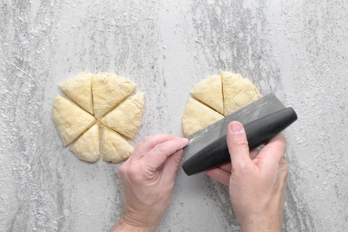 Kneaded dough divided into two five inch circles.
