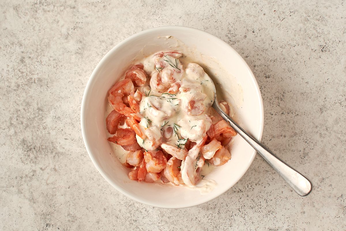 Toss shrimp in dressing