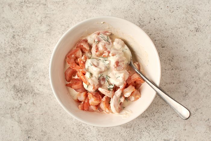 Toss shrimp in dressing