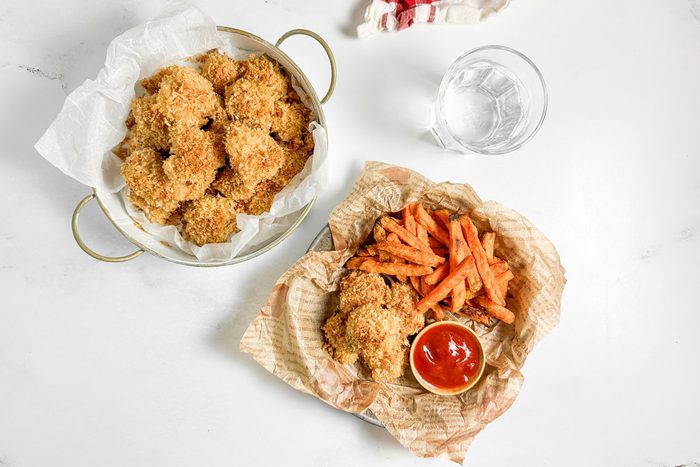 Taste of Home Spicy Chicken Nuggets with ketchup and sweet potato fries