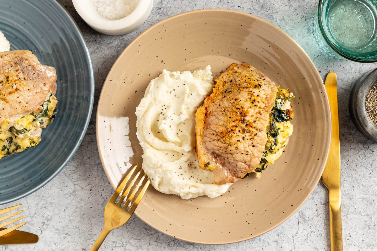 Taste of Home Stuffed Pork Chops photo of the finished recipe served on plates.