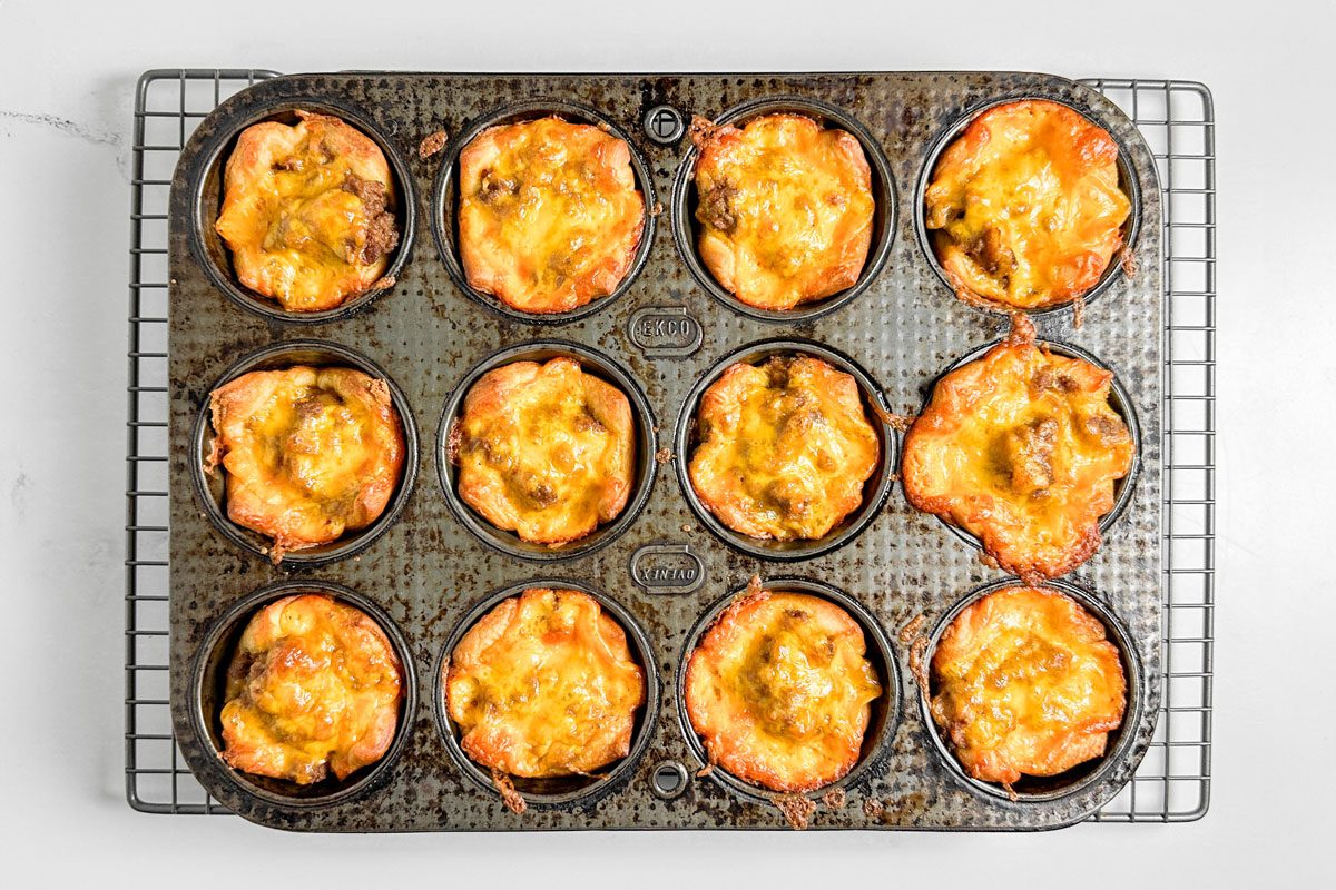 Taste of Home Taco Cups in a vintage muffin tin on a wire rack