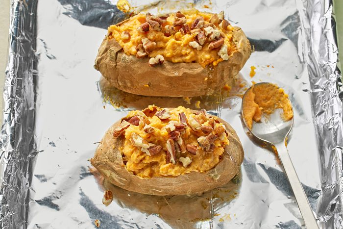 Potato pulp, cream cheese, brown sugar and cinnamon mixture spooned inside potato shells.