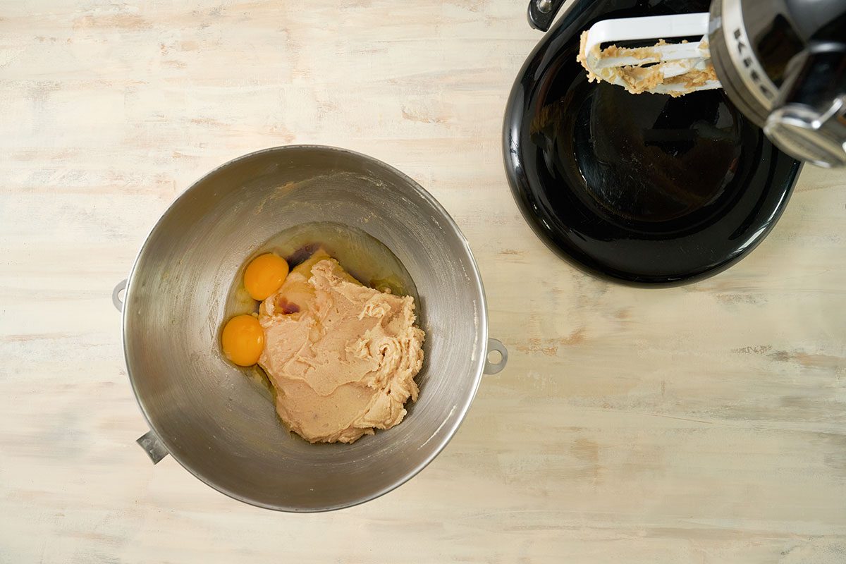 Overhead view of eggs and vanilla extract and creamed butter and sugar mixture for the Taste of Home Air Fryer Oatmeal Cookies recipe.